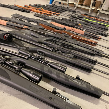 Table full of airguns at an airgun show